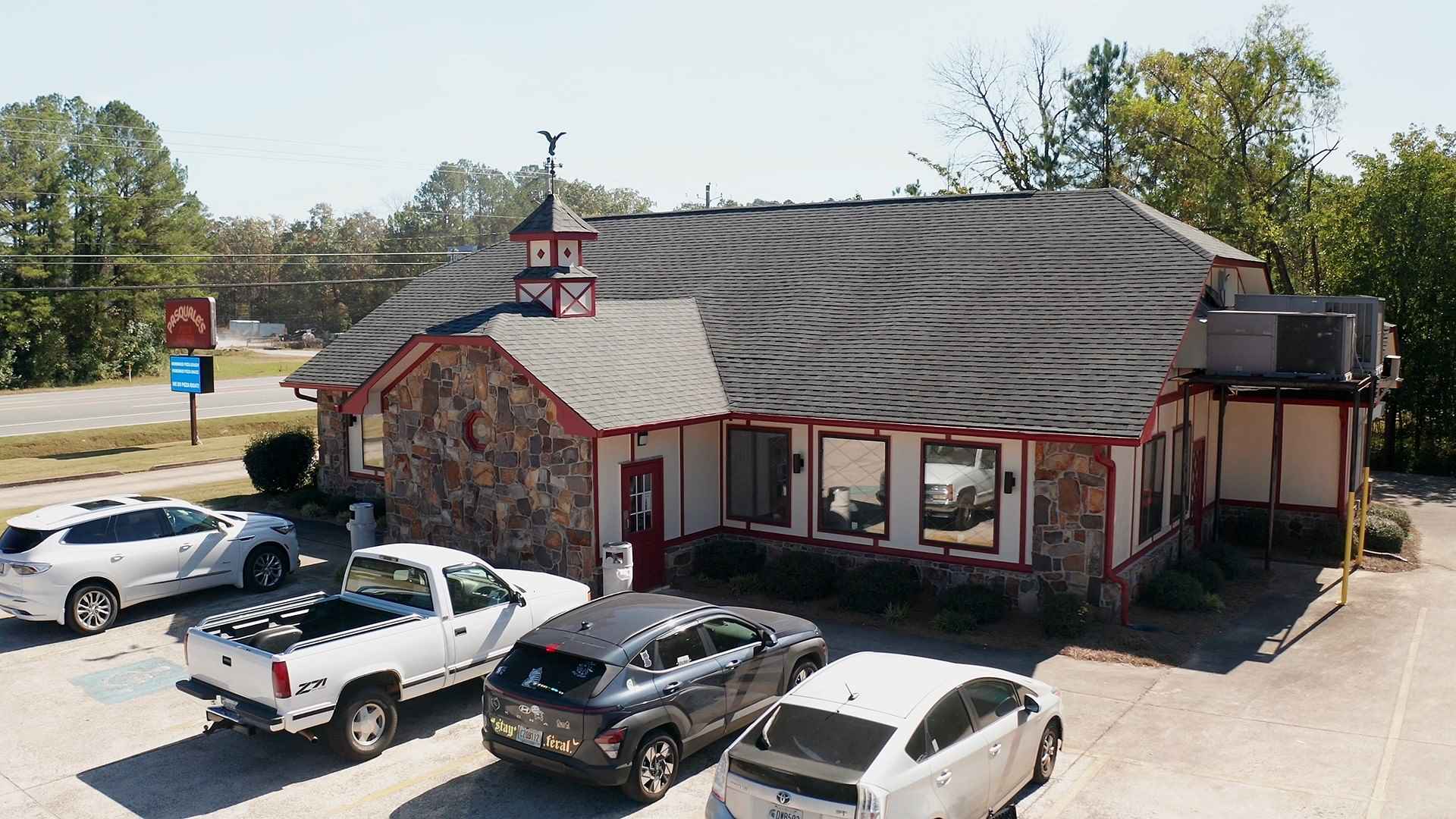 Pasquale's Pizza and Pasta neon sign glowing at their Armuchee, Georgia location