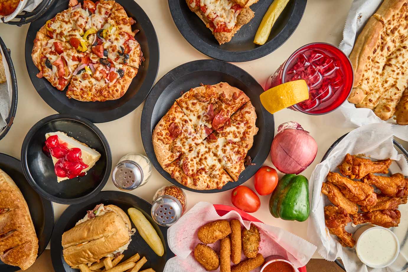 Assorted pizzas and pasta at Pasquale's Pizza & Pasta